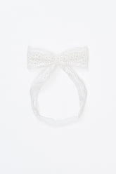 Avauma Rumiere Ribbon Band - Cotton Cream laid flat on a white background, showing full lace bow